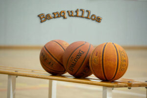 Three basketball balls in the left side with white background.
